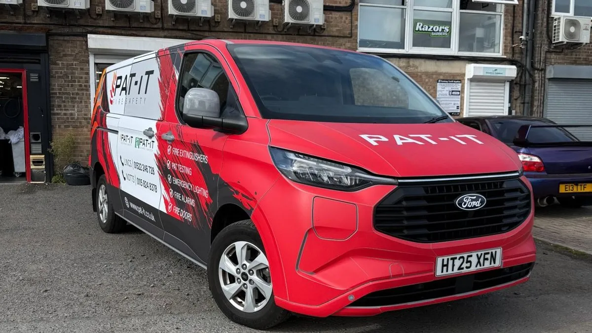 PAT-IT Ford Transit Custom with red, black and white modular wrap and colour coded bumper