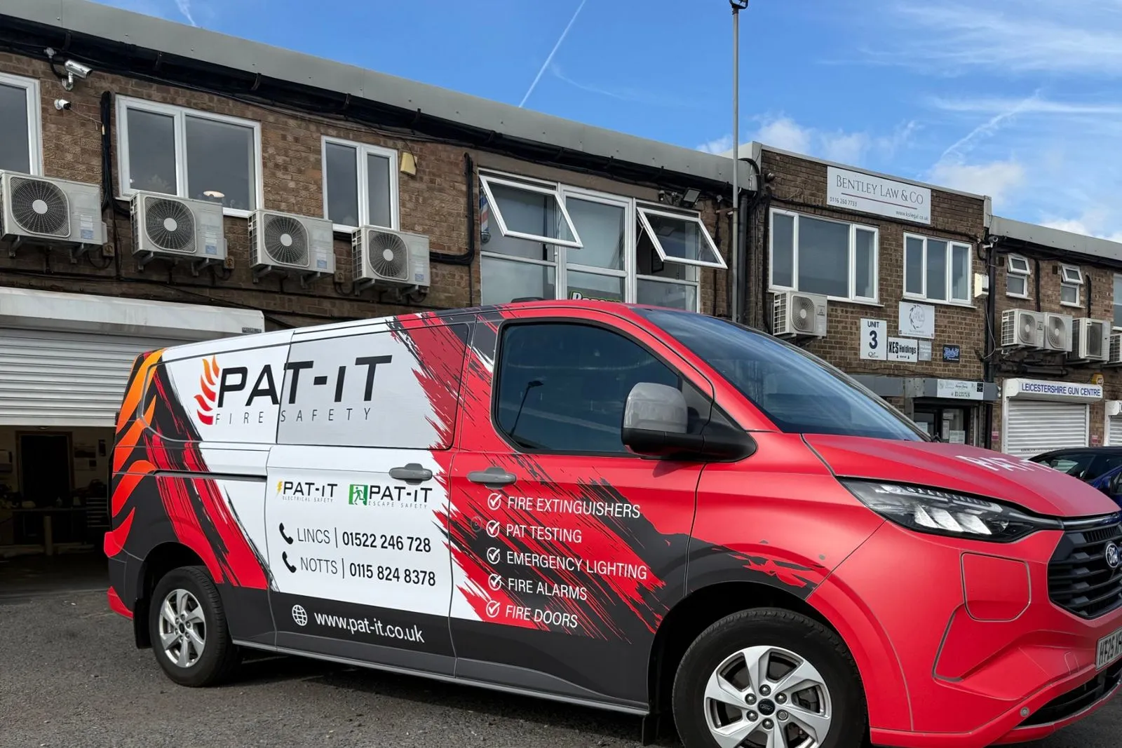 Side of the PAT-IT van showing the modular wrap and business branding